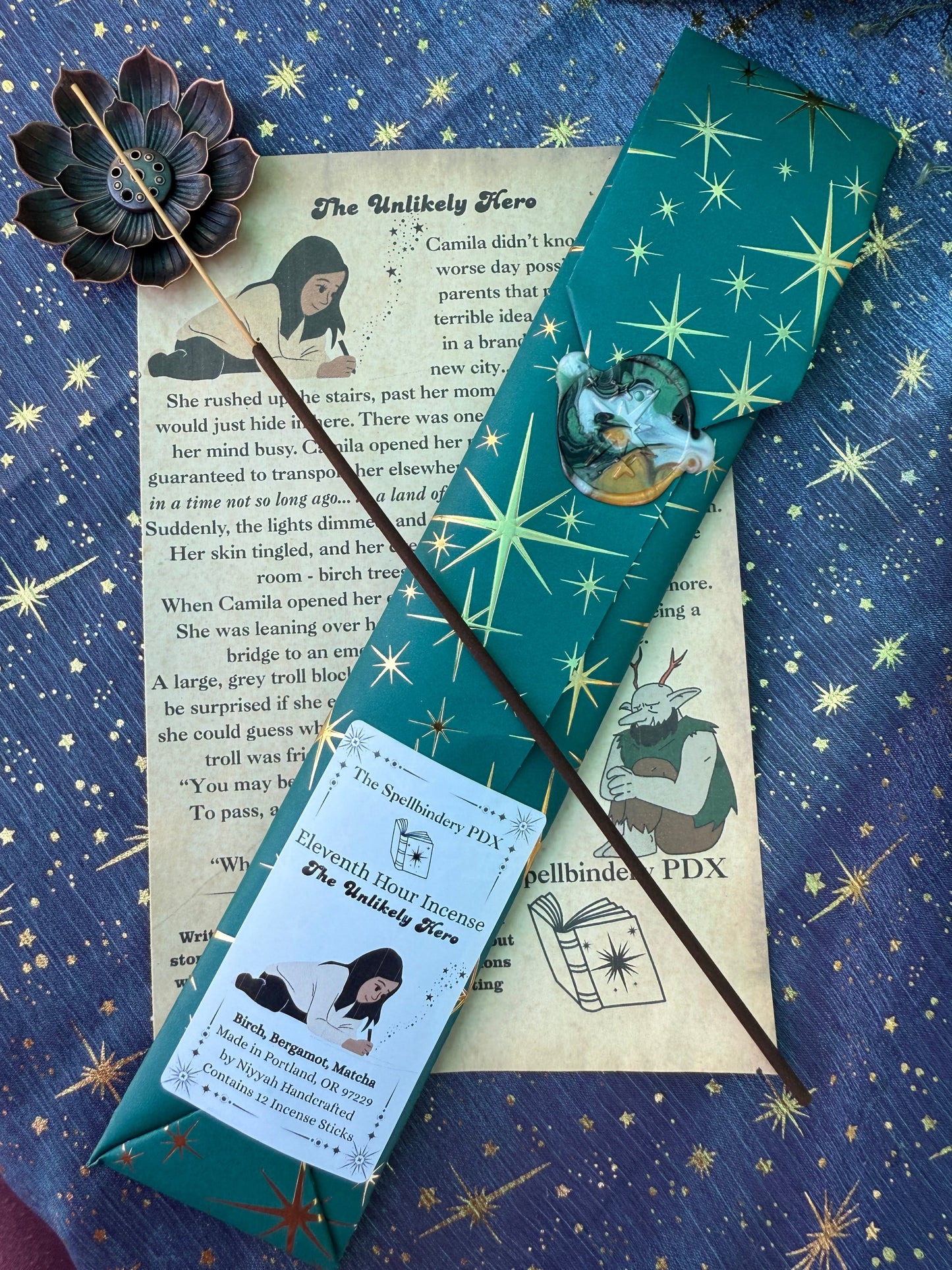 Incense stick, package, lotus holder on top of a story, against a blue starry background
